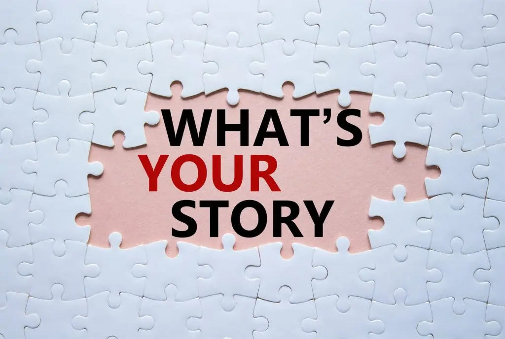 Photo of missing puzzle pieces revealing the words "What's Your Story."