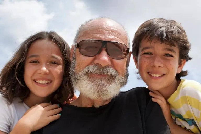 Photo of a grandfather with his two grandchildren